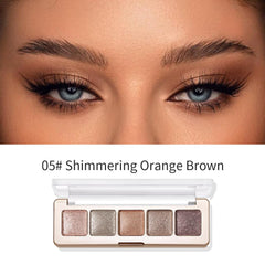 Hxssll fingertip pressing glitter onto eyelid demonstrating high payoff