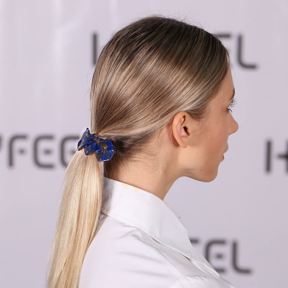 HYFEEL barrette resting in hand to show size and scale, easy-to-use and travel-friendly benefit