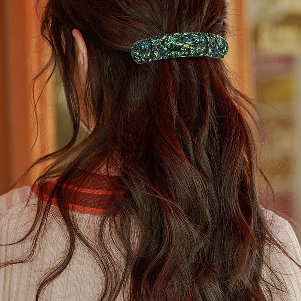 HYFEEL barrette in hand showing scale and easy handling for quick styling
