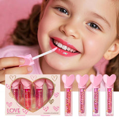iBi Makeup gloss sticks next to hand for scale, indicates kid-friendly compact size