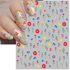 IDDFEVE finished manicure with floral leaf decals offering a soft seasonal look