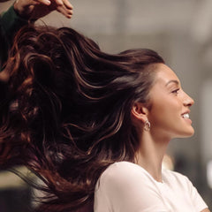 IGK conditioner texture pouring to show creamy slip for detangling and smoothness
