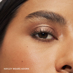 ILIA eye stylus texture swatch on skin showing creamy shimmer payoff