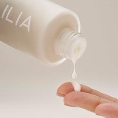 ILIA application with fingers showing quick spreadability and layering benefit