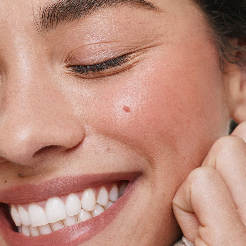 ILIA multi-stick swipe on cheek demonstrating natural-looking flush benefit