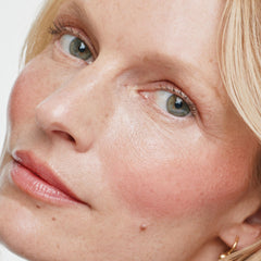 ILIA applying multi‑stick to cheek demonstrating easy blend and glow