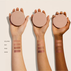 ILIA open compact flatlay revealing pan and mirror for on-the-go touchups and convenience benefit