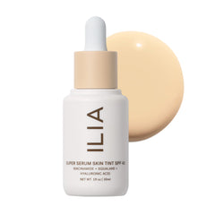 ILIA front bottle of Super Serum Skin Tint showing Tulum ST2 shade and SPF benefit