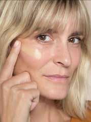 ILIA skin tint next to brush and compact showing layering compatibility