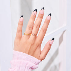imPRESS hand applying a press-on nail showing quick easy application