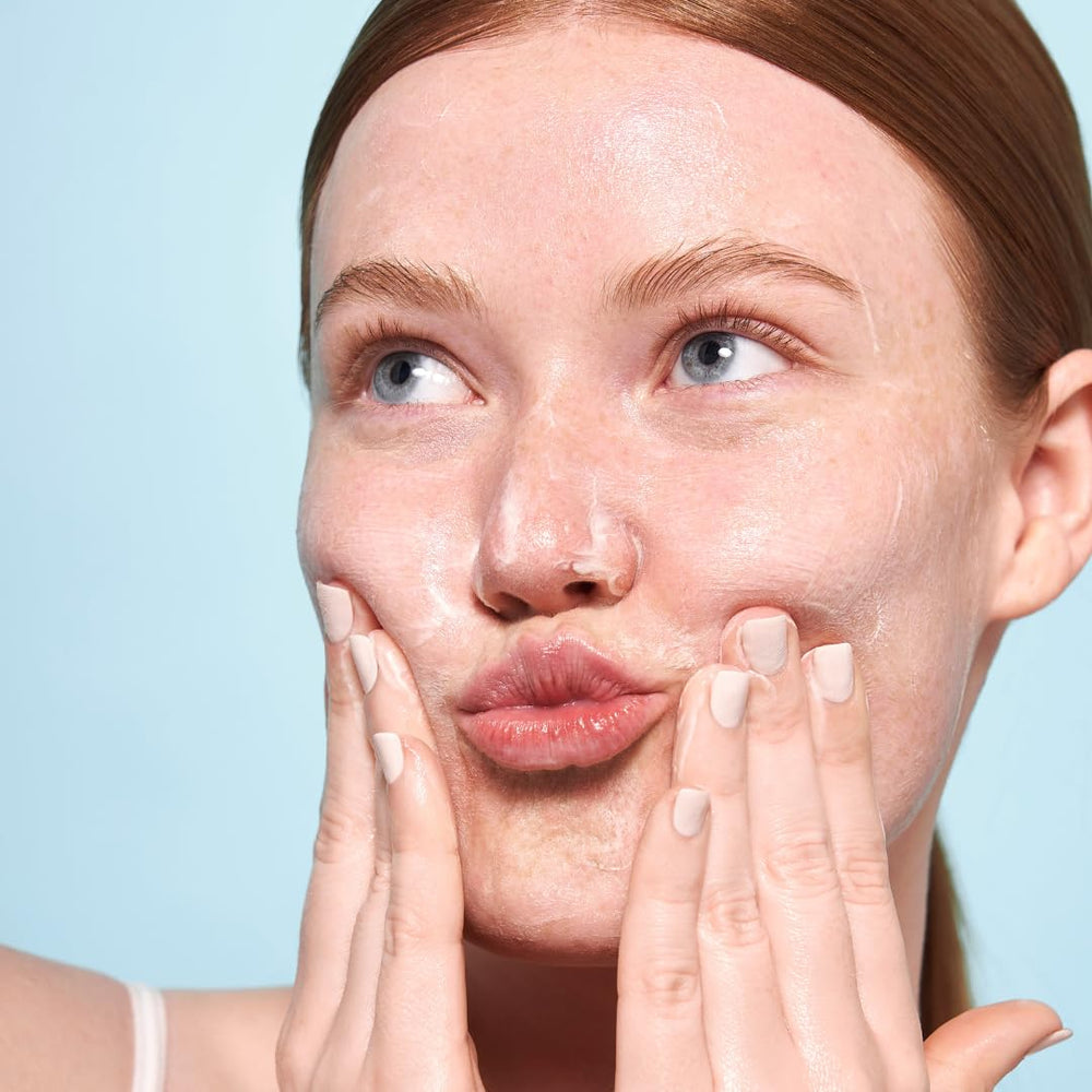 Indie Lee cleanser lather on hand demonstrating effective makeup removal