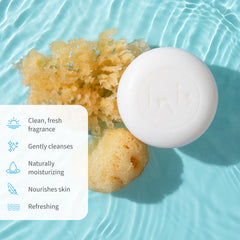 Inis soap next to a coin showing 3.5 oz size and travel-friendly convenience