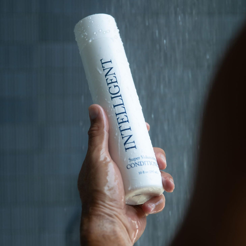 Intelligent Shop conditioner on bathroom shelf with styling items, suggests daily routine volume benefit