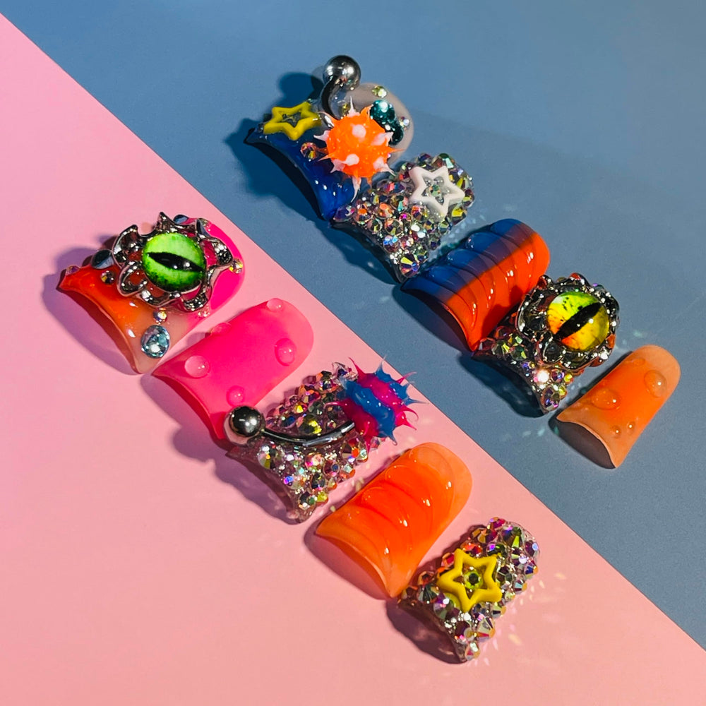IntoVibes close-up of the orange barbell charm highlighting handcrafted detail benefit: eye-catching accents
