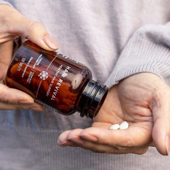 Isagenix tablets on bathroom counter as part of daily routine