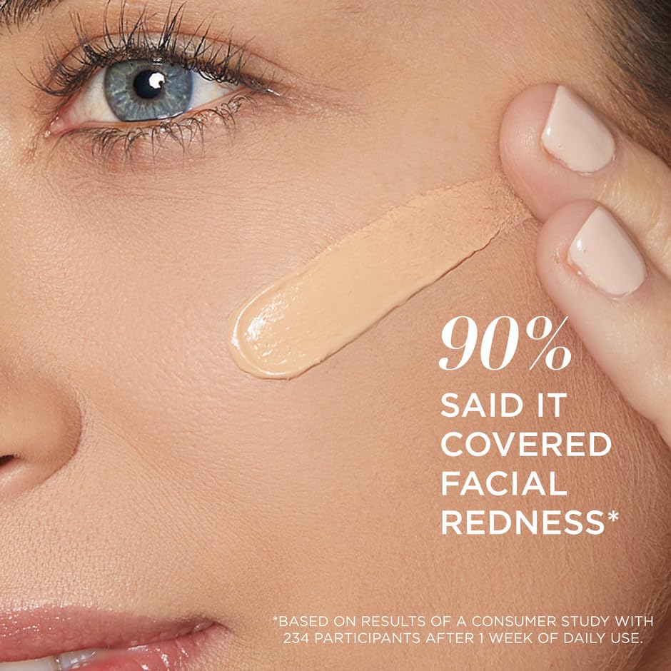 IT Cosmetics tube held by fingers to show size and travel-friendly benefit