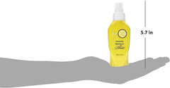 It's a 10 Haircare serum drops on hand showing lightweight texture and quick absorption