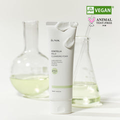 IUNIK bottle beside centella leaves highlighting natural extract, soothing benefit