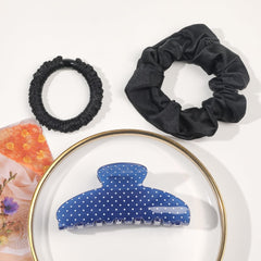 Ivyu clip with two black satin scrunchies flatlay for styling options