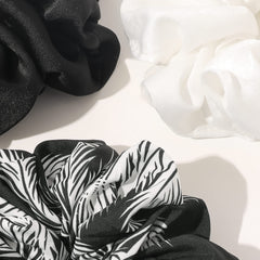 Ivyu model wearing oversized scrunchie holding thick hair showing secure, stylish hold