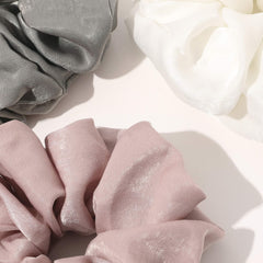 Ivyu scrunchie close-up of satin texture protecting hair strands