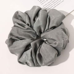 Ivyu scrunchie styled in a neat bun for polished look