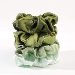 Ivyu scrunchie size shown next to coin to show scale and generous wrap capacity