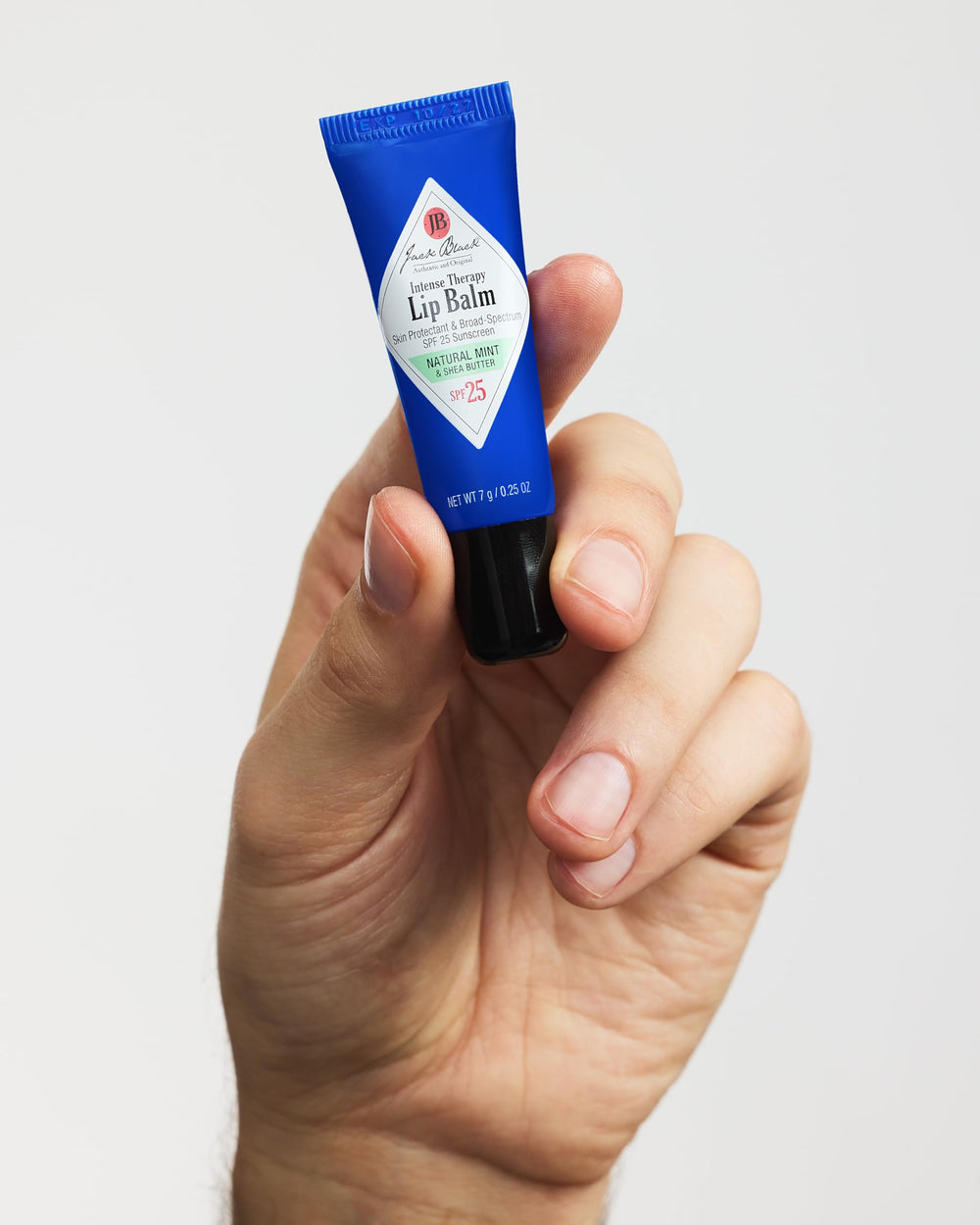 Jack Black being applied to lips outdoors for soothing protection