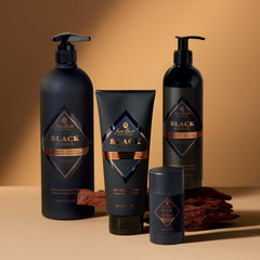 Jack Black body lotion applied to forearm in bathroom, shows quick-absorbing finish