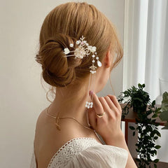 Jaczora hairpins styled in bridal updo to demonstrate elegant finished look
