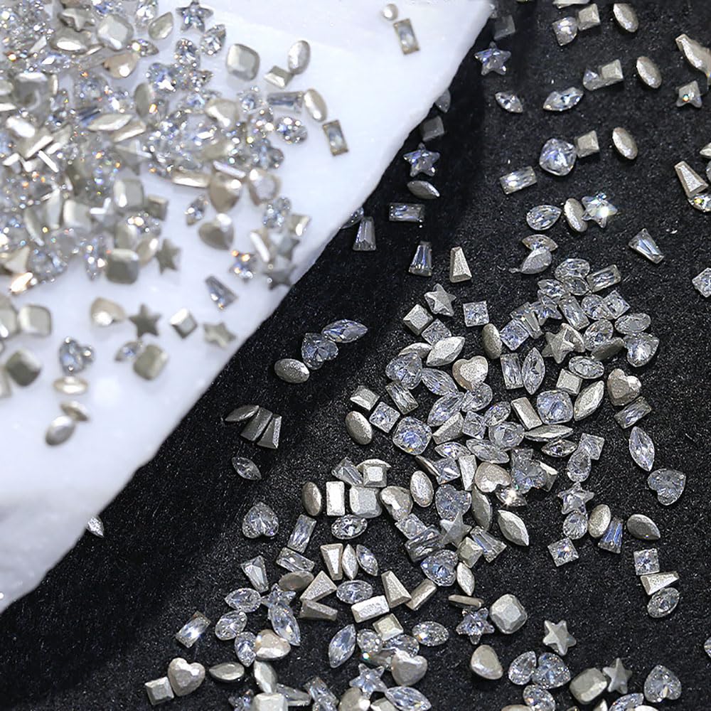 Jaliya rhinestones in hand showing 2–3mm scale for delicate nail art