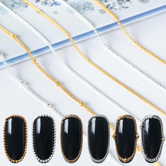JERCLITY chains applied on acrylic nails showing sleek metallic accents benefit