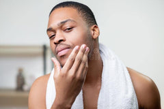 Jersey Botanical shea butter scoop applied to skin for instant moisturize