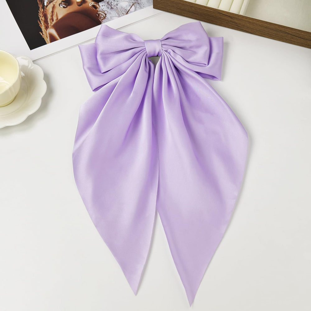 JGQUR bow beside ruler showing 7.8x14 inch size for styling scale