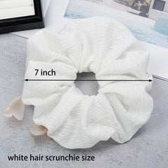 JGQUR scrunchie stretched to reveal elastic core and secure grip