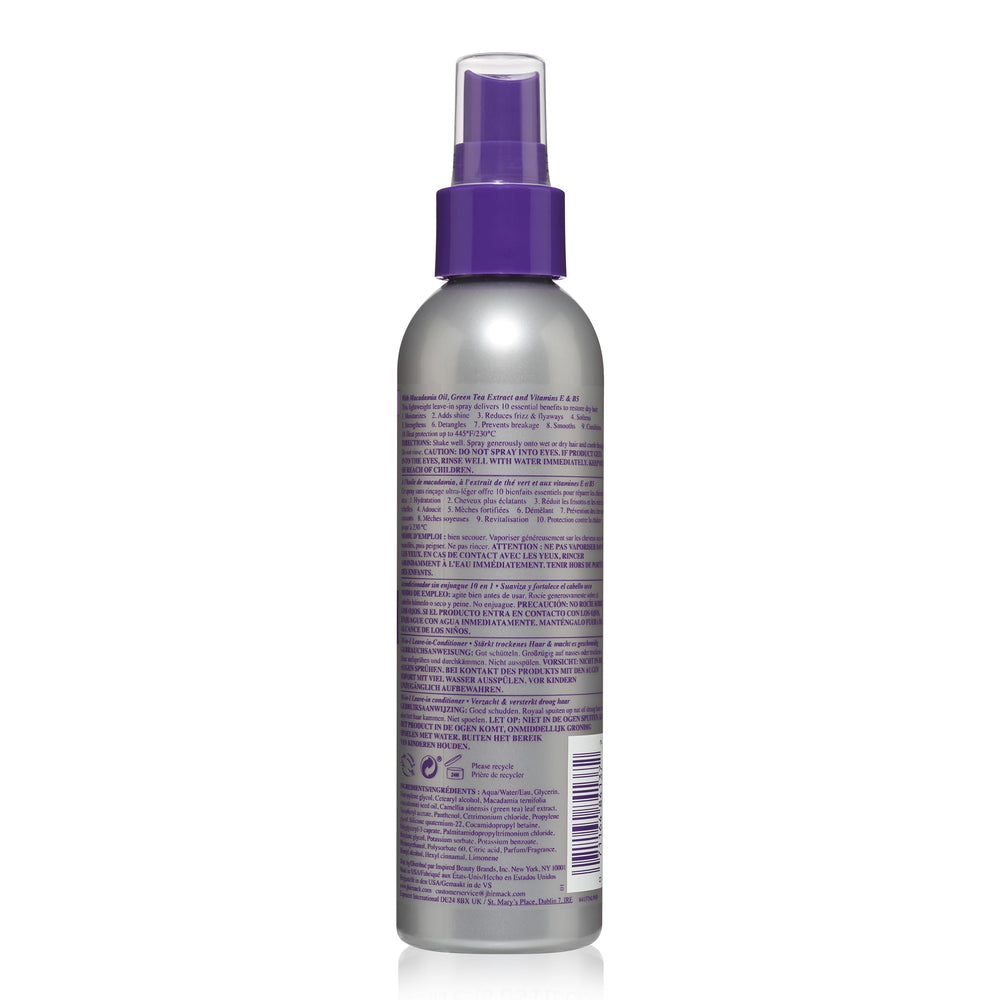 jhirmack bottle next to hairbrush showing travel-friendly size and convenience