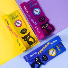 Hand applying Jigott mascara to lashes illustrating easy root-to-tip lift