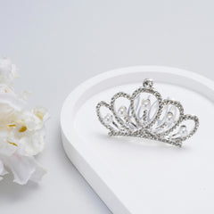 JINYEAH crown beside a coin to show compact scale benefit