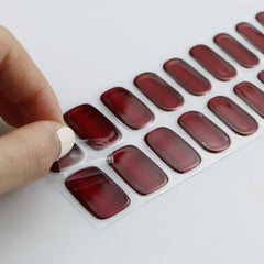 jmeowio hand applying strip under UV lamp for quick professional cure