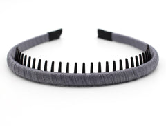 JOBAND hairband next to hand for size comparison highlighting slim profile