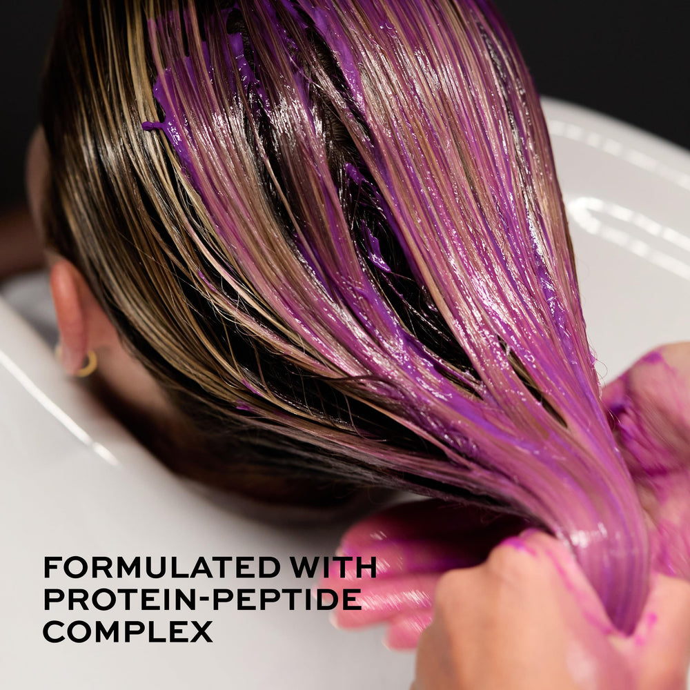 John Frieda product label close-up highlighting vegan no-ammonia benefit