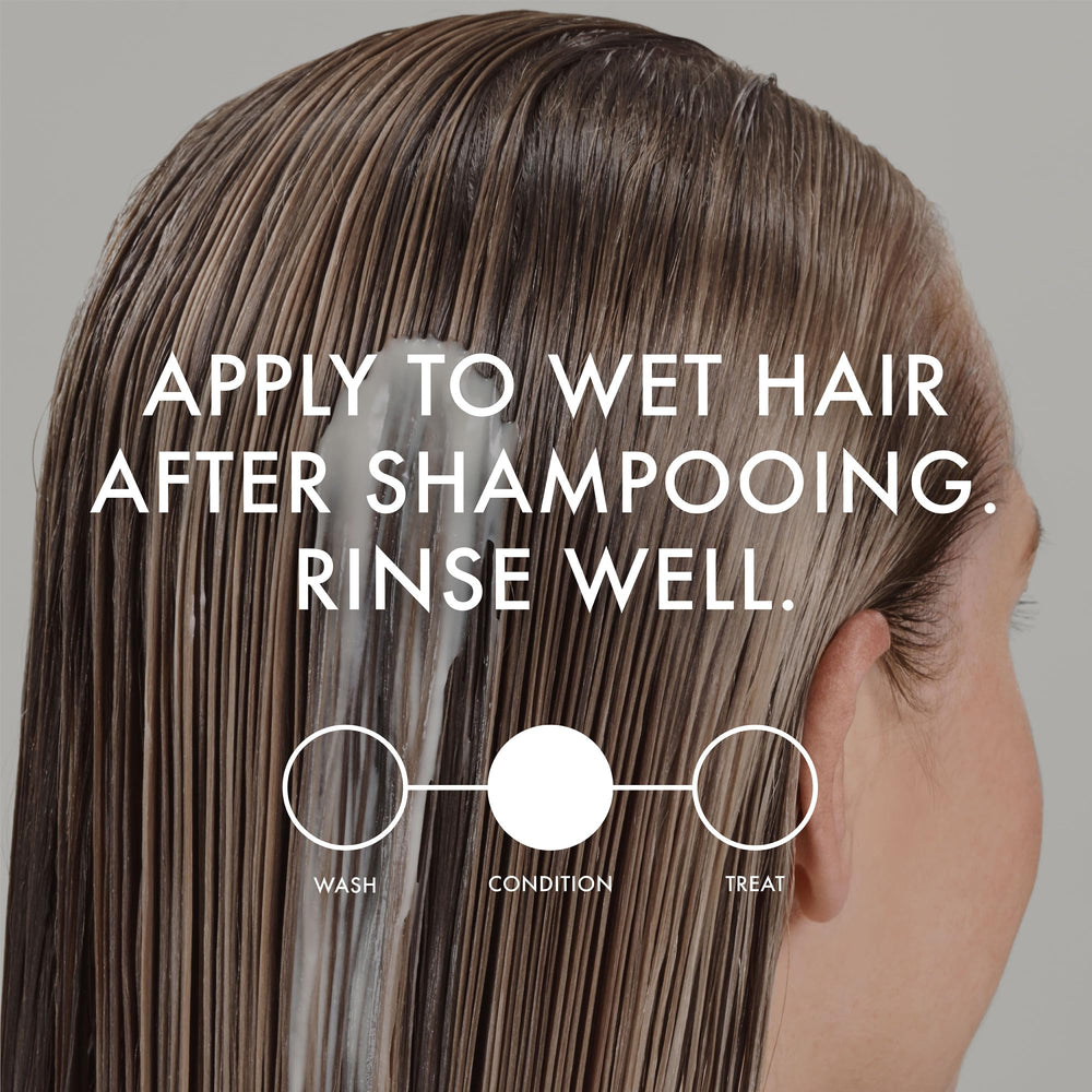 John Frieda model with sunlit blonde hair showing hydrated shine