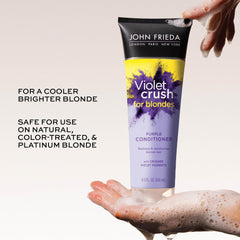 John Frieda conditioner being applied to blonde hair for toning