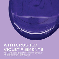 Person applying John Frieda Violet Crush in shower illustrating at-home toning routine