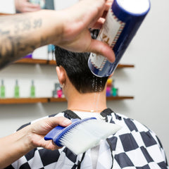 JOHNNY B. in use at barber station for post-cut comfort