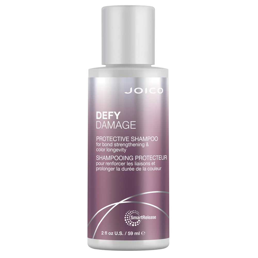Joico Defy Damage shampoo being poured to show smooth texture and ease of use