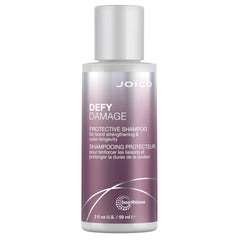 Joico Defy Damage shampoo being poured to show smooth texture and ease of use