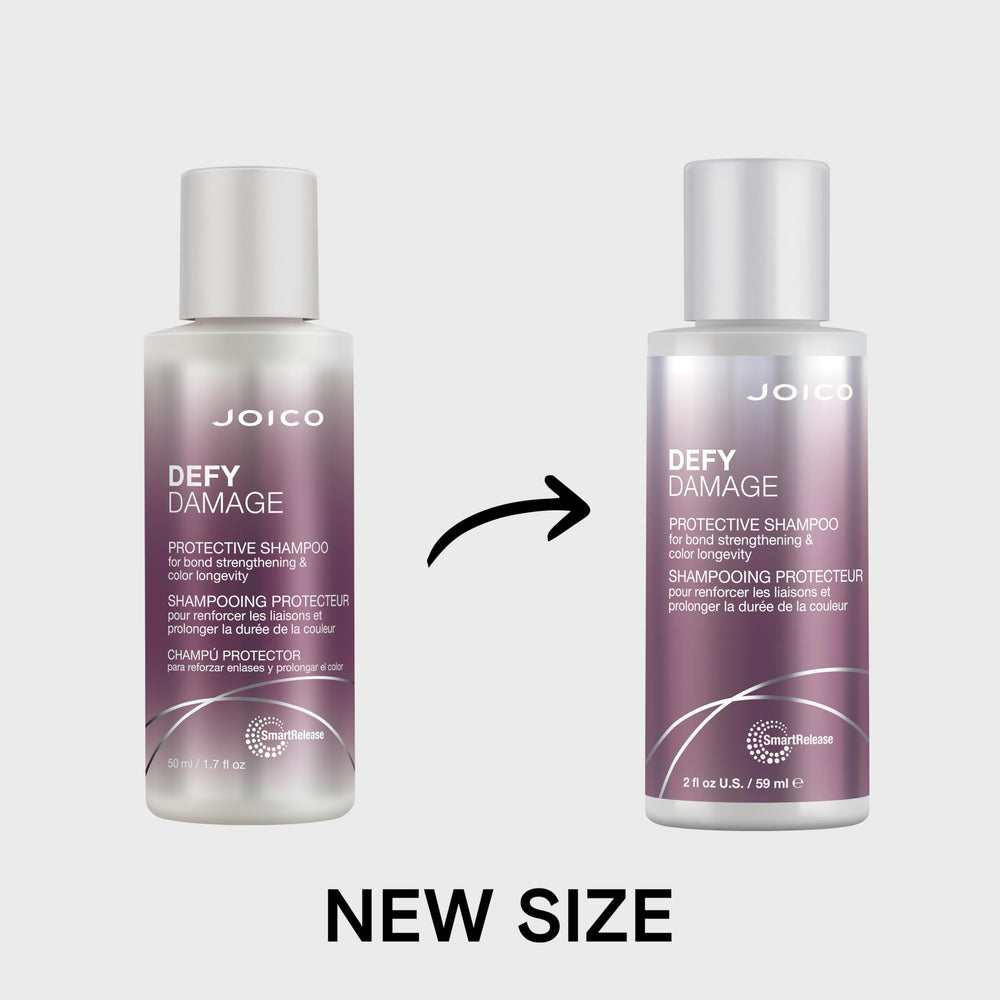 Joico Defy Damage 2 oz next to passport to show compact travel-friendly size