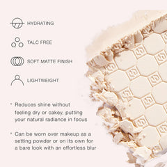 Jouer applying powder with brush to T-zone showing smooth application and shine control