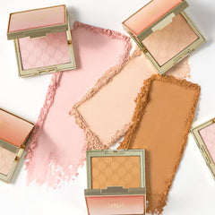 Jouer compact next to lipstick for scale showing travel-friendly size and on-the-go refresh benefit